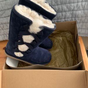 Tall boots made and sold by UGG